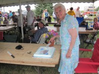Esther Thompson (nee Erickson) cutting cake
