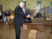 Carol Colbow opening the 1996 time Capsule at the Library