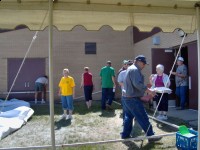 Tent being taken down for Amulet Picnic